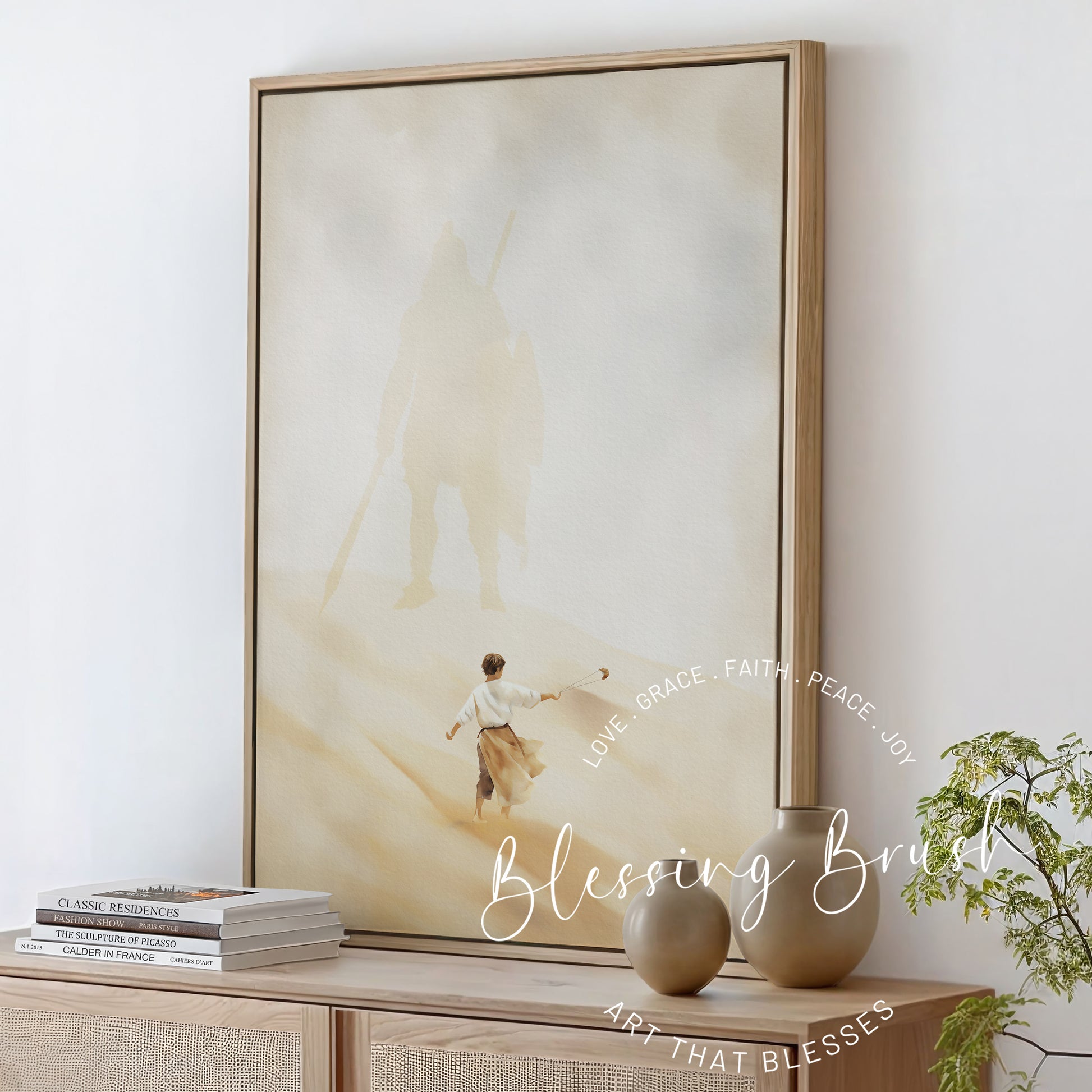 Christian watercolor painting of young David facing the giant Goliath’s shadow, framed neutral-toned canvas wall art inspired by 1 Samuel 17, Blessing Brush.