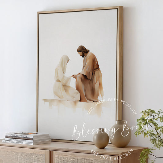 Watercolor painting of Jesus kneeling before a woman, holding her hands in a gentle moment of healing and compassion, framed Christian wall art in neutral tones, Blessing Brush.