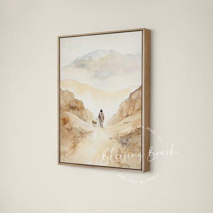 Jesus walking beside a sheep through a beige mountain valley, Psalm 23 Good Shepherd framed canvas wall art by Blessing Brush