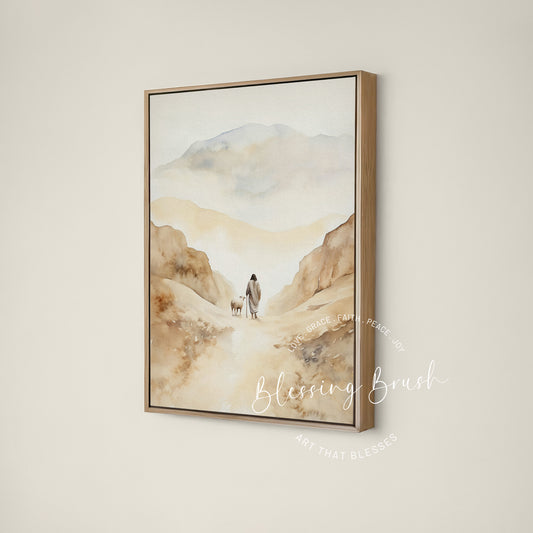 Jesus walking beside a sheep through a beige mountain valley, Psalm 23 Good Shepherd framed canvas wall art by Blessing Brush
